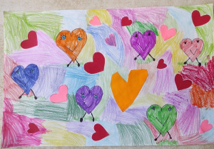 Walentynkowa praca przedstawiająca tęczowe serduszka.