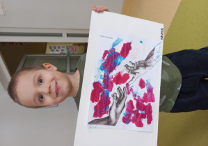 Kacperek prezentuję wykonaną pracę w oparciu o fresk Michała Anioła